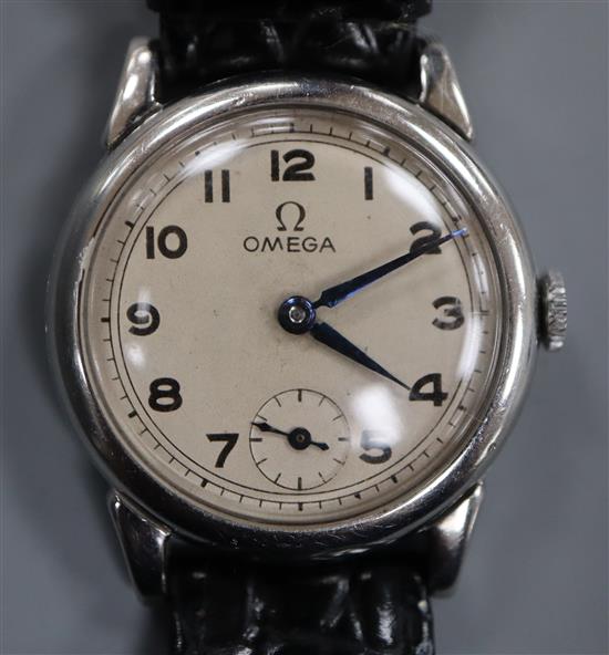 A gentleman's 1930's stainless steel Omega manual wind mid-size wrist watch, with Arabic dial and subsidiary seconds.